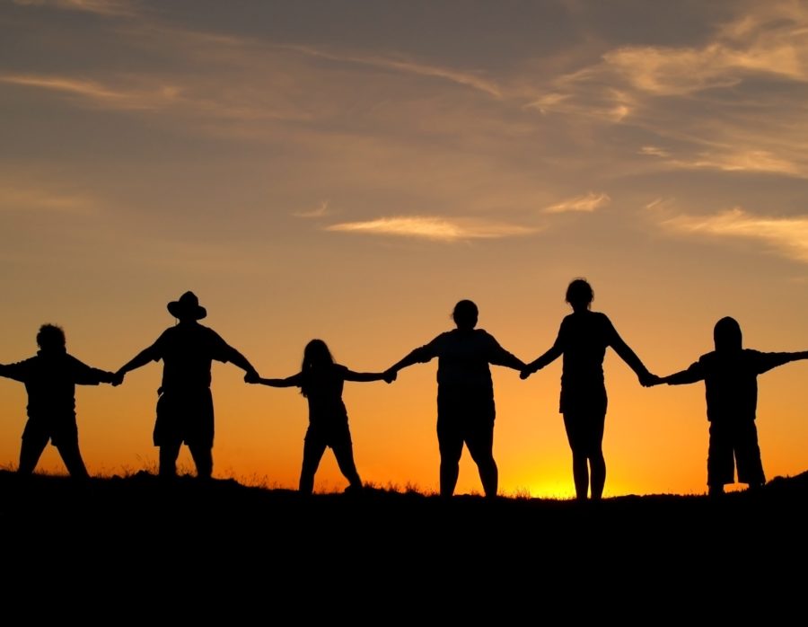 Many people join hands to represent a family unity.