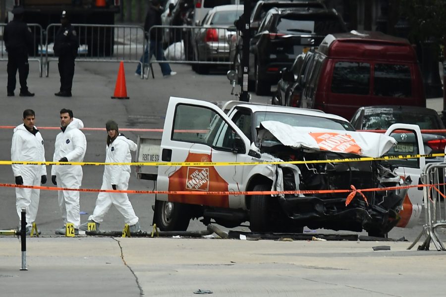 Investigators work around the wreckage of a Home Depot pickup truck a day after it was used in a terror attack in New York on November 1, 2017.
The pickup truck driver who plowed down a New York cycle path, killing eight people, in the citys worst attack since September 11, was associated with the Islamic State group but radicalized domestically, the states governor said Wednesday. The driver, identified as Uzbek national named Sayfullo Saipov was shot by police in the stomach at the end of the rampage, but he was expected to survive. / AFP PHOTO / Jewel SAMAD        (Photo credit should read JEWEL SAMAD/AFP/Getty Images)